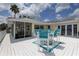 Charming outdoor deck with stylish seating, solar panels, and gorgeous views at 9914 Alavista Dr, Gibsonton, FL 33534