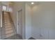 Bright entryway with stairs, door, and wainscoting; a functional and stylish space at 9914 Alavista Dr, Gibsonton, FL 33534