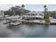 Waterfront home with boat lift, solar panels, wraparound deck, outdoor bar, and ample space for entertaining at 9914 Alavista Dr, Gibsonton, FL 33534