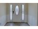 Welcoming front door with decorative glass and sidelights in a modern entryway at 9914 Alavista Dr, Gibsonton, FL 33534