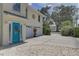 Charming two-story home with a two car garage, coastal landscaping and a driveway to the street at 9914 Alavista Dr, Gibsonton, FL 33534