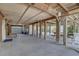 Lower-level space with wooden beams, a ping pong table, a picnic table, and more at 9914 Alavista Dr, Gibsonton, FL 33534