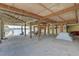 Lower-level space with wooden beams, a picnic table, a tent, and view to the water at 9914 Alavista Dr, Gibsonton, FL 33534