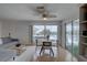 Cozy seating area with dining and sliding glass doors to deck offers lovely natural light and views at 9914 Alavista Dr, Gibsonton, FL 33534