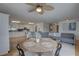Open-concept kitchen flows into living area featuring modern decor and lots of natural light at 9914 Alavista Dr, Gibsonton, FL 33534
