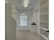 Spacious walk-in closet with custom shelving and drawers for optimal storage at 9914 Alavista Dr, Gibsonton, FL 33534