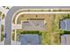 Aerial view of single-story home with 2 car garage and landscaped lawns surrounded by two-story homes at 10360 Honeysuckle Vine Cir, Riverview, FL 33578