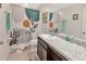 Bathroom features a modern shower curtain, vanity with sink, and a large mirror at 10360 Honeysuckle Vine Cir, Riverview, FL 33578