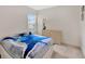 Bright bedroom with dresser, window, and comfortable bedspread at 10360 Honeysuckle Vine Cir, Riverview, FL 33578