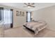 Calm bedroom with a ceiling fan, neutral color scheme, and plenty of natural light at 10360 Honeysuckle Vine Cir, Riverview, FL 33578