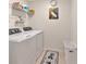 Functional laundry room features a modern washer and dryer set with storage at 10360 Honeysuckle Vine Cir, Riverview, FL 33578