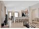 Open-concept living area flowing into a kitchen, complete with bar seating and contemporary appliances for modern living at 10360 Honeysuckle Vine Cir, Riverview, FL 33578