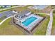 Community swimming pool featuring lounge chairs, cabana and well-maintained landscaping, creating a serene and inviting atmosphere at 10360 Honeysuckle Vine Cir, Riverview, FL 33578