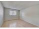 Bright bedroom with neutral walls, tile flooring, and a window bringing in natural light at 10509 Waterview Ct, Tampa, FL 33615