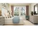 Inviting bedroom features comfortable decor, a large window, and elegant furnishings at 10853 Rustic Eve Ct, Land O Lakes, FL 34638