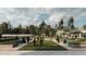 Community park with playground, greenery, and people enjoying recreational activities at 10853 Rustic Eve Ct, Land O Lakes, FL 34638