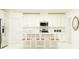 Bright, modern kitchen with stainless steel appliances and white cabinetry at 10853 Rustic Eve Ct, Land O Lakes, FL 34638
