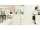 Modern, open kitchen with stainless appliances and seating at the island at 10853 Rustic Eve Ct, Land O Lakes, FL 34638