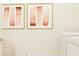 Modern laundry room with modern art and appliances at 10853 Rustic Eve Ct, Land O Lakes, FL 34638