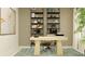 Well-appointed home office with built in shelving and modern décor at 10853 Rustic Eve Ct, Land O Lakes, FL 34638