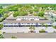 Aerial view of townhome community with mature landscaping, assigned parking and convenient access at 1137 King Arthur Ct # 501, Dunedin, FL 34698
