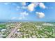 Overhead shot of townhome community close to the water and local businesses with mature landscaping at 1137 King Arthur Ct # 501, Dunedin, FL 34698
