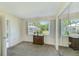 Bright bedroom features neutral carpet, window with backyard view and mirrored closet at 1137 King Arthur Ct # 501, Dunedin, FL 34698