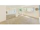 Spacious bedroom with large closets, neutral carpet, and plenty of natural light at 1137 King Arthur Ct # 501, Dunedin, FL 34698