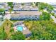 Aerial view of the community pool, showcasing meticulously maintained landscaping and community gathering spaces at 1137 King Arthur Ct # 501, Dunedin, FL 34698