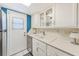 Clean kitchen showcasing white cabinetry, stainless steel appliances, and access to the outside at 1137 King Arthur Ct # 501, Dunedin, FL 34698