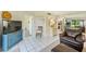Cozy living room with tile flooring, comfortable seating, and access to kitchen and bedrooms at 1137 King Arthur Ct # 501, Dunedin, FL 34698