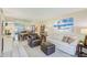 Comfortable living room with ample seating, stylish decor, and access to the dining area at 1137 King Arthur Ct # 501, Dunedin, FL 34698
