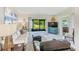 Bright living room featuring sliding glass doors, neutral decor, and comfortable seating at 1137 King Arthur Ct # 501, Dunedin, FL 34698