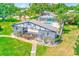 Community pool area featuring a covered cabana and outdoor lounge space for entertaining and relaxation at 1137 King Arthur Ct # 501, Dunedin, FL 34698