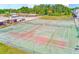View of the community tennis courts perfect for recreation and exercise, surrounded by a secure fence at 1137 King Arthur Ct # 501, Dunedin, FL 34698