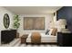 Modern bedroom features a stylish bed frame, elegant decor, and soft natural light at 11767 Brae Way, Dade City, FL 33525