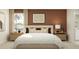 A primary bedroom with coordinated lamps, nightstands, and neutral decor at 11775 Brae Way, Dade City, FL 33525