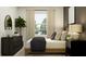 Cozy bedroom with natural light, modern furnishings, and decorative plant accents at 11947 Brae Way, Dade City, FL 33525