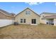 A backyard featuring a grassy yard and an adjacent screened-in patio at 12028 Citrus Leaf Dr, Gibsonton, FL 33534