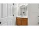 Bathroom featuring a vanity with a wood cabinet and a white countertop at 12028 Citrus Leaf Dr, Gibsonton, FL 33534