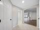 Inviting foyer with tile flooring leading to an open-concept living space with wood floors at 12028 Citrus Leaf Dr, Gibsonton, FL 33534