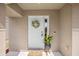 The front door features a decorative wreath and side panel window, adding curb appeal at 12028 Citrus Leaf Dr, Gibsonton, FL 33534