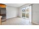 Bright kitchen area with stainless steel refrigerator and access to the backyard at 12028 Citrus Leaf Dr, Gibsonton, FL 33534