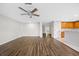Bright living room features hardwood floors and an open concept floorplan with the kitchen at 12028 Citrus Leaf Dr, Gibsonton, FL 33534