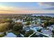 Aerial view of the neighborhood highlighting mature trees, and nearby river at 1211 64Th Nw St, Bradenton, FL 34209