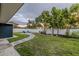 Backyard featuring a pebble pathway, manicured lawn and a seating area at 1211 64Th Nw St, Bradenton, FL 34209