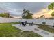 Well maintained backyard area with white rock and seating around a fire pit at 1211 64Th Nw St, Bradenton, FL 34209