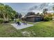 Exterior of home showing pebble stone patio area at 1211 64Th Nw St, Bradenton, FL 34209