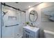 Stylish bathroom with a glass-enclosed shower, modern vanity, and neutral color palette at 1211 64Th Nw St, Bradenton, FL 34209