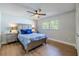 Cozy bedroom with natural light, wood floors, ceiling fan, and neutral wall color at 1211 64Th Nw St, Bradenton, FL 34209